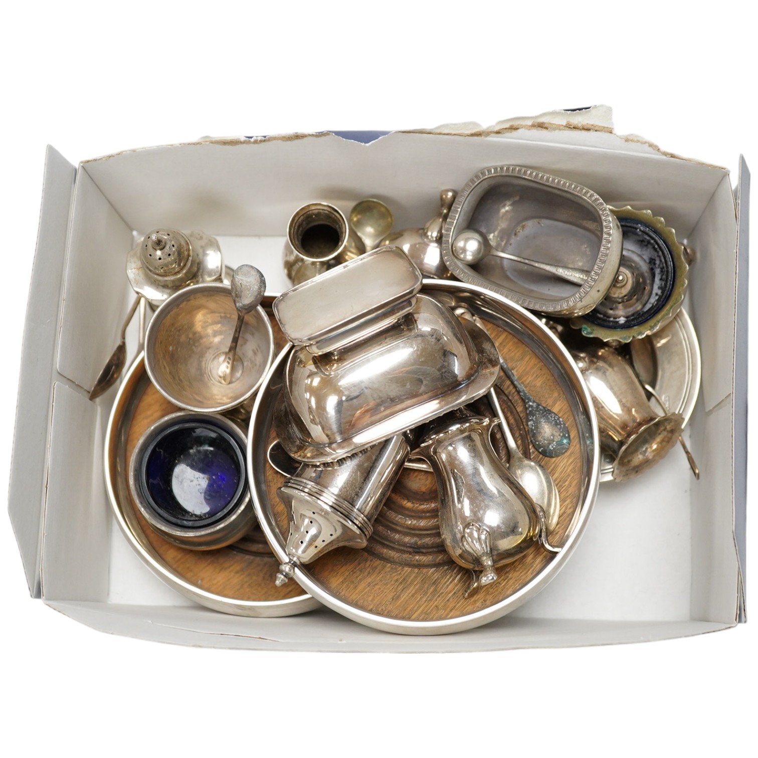 A pair of modern silver decanter coasters, London, 1973 and a collection of silver condiments etc. Condition - poor to fair